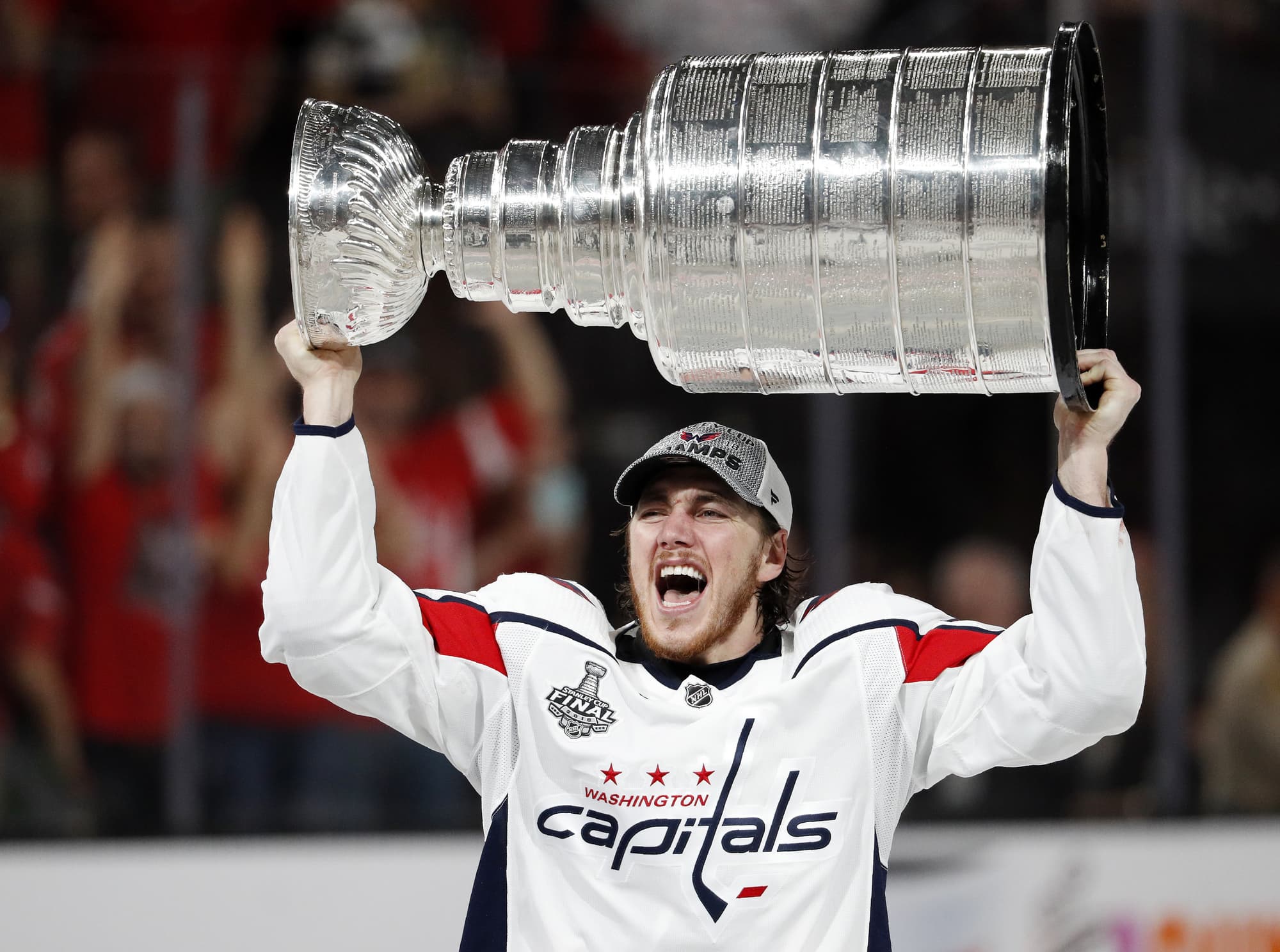 Washington Capitals right wing T.J. Oshie hoists the Stanley Cup after the Capitals defeated the Golden Knights 4-3 in Game 5 of the NHL hockey Stanley Cup Finals Thursday, June 7, 2018, in Las Vegas. (AP Photo/John Locher)