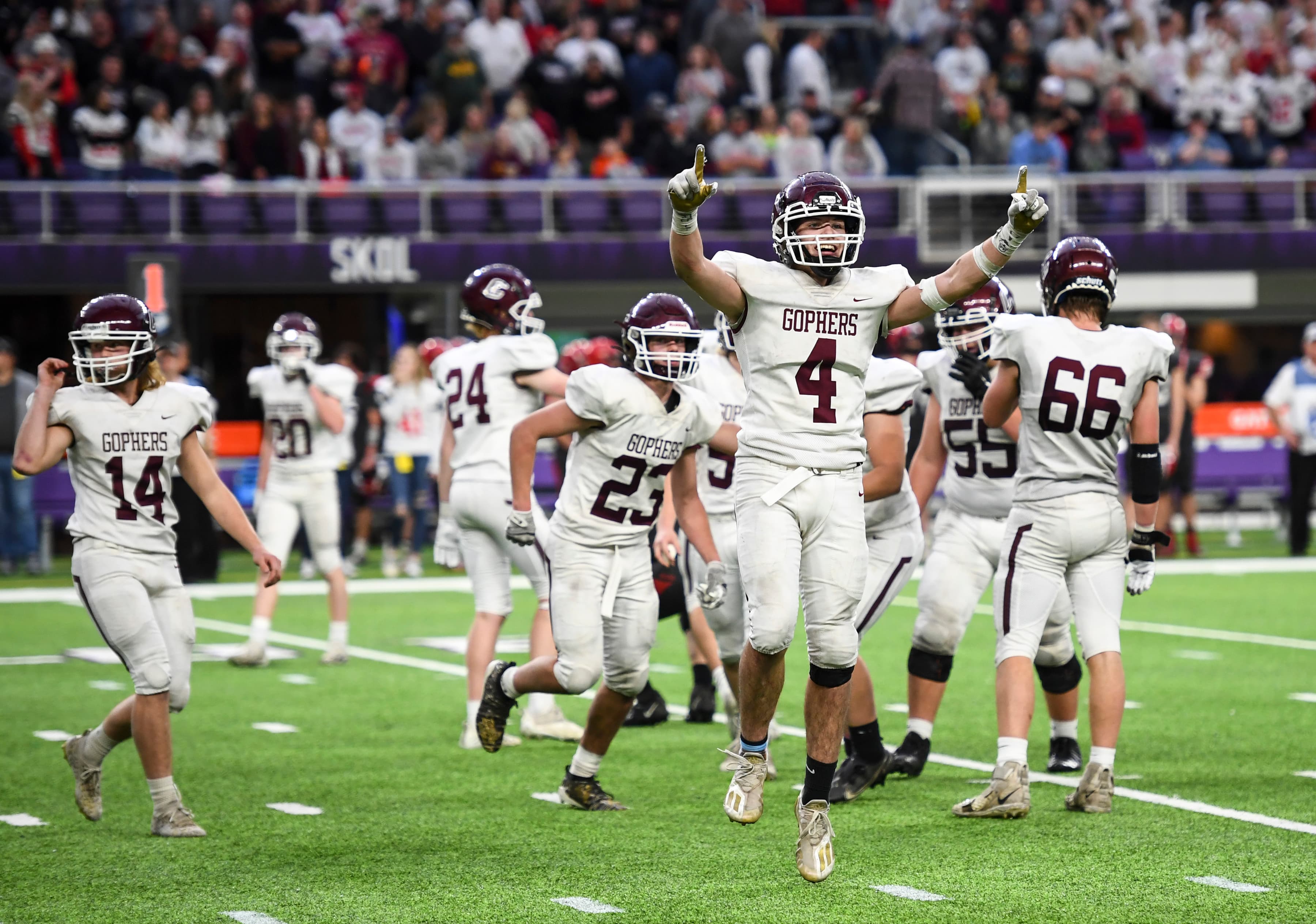Chatfield players, including tight end Grady Schott (4), celebrate the final moments of the fourth quarter during the Class 2A state tournament championship football game between Chatfield and West Central Area/Ashby Friday, Nov. 26, 2021 at U.S. Bank Stadium in Minneapolis, Minn. Chatfield defeated West Central Area/Ashby 14-13.